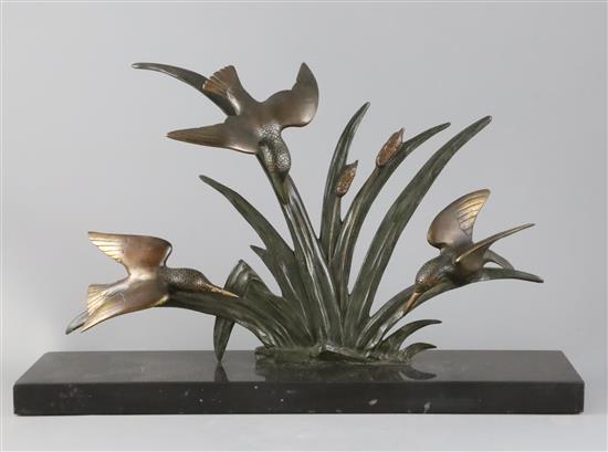 G. Limousin. A French Art Deco bronze group of three kingfishers flying amongst bulrushes, W.19.75in.